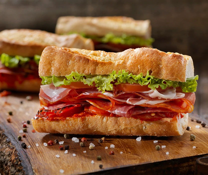 Sub sandwich with meats and lettuce.